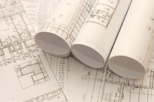 depositphotos_2609830-stock-photo-rolls-of-engineering-drawings